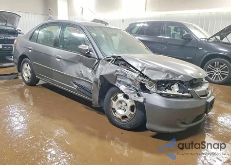 2004 Honda Civic Hybrid from USA, damaged, VIN JHMES95694S013386